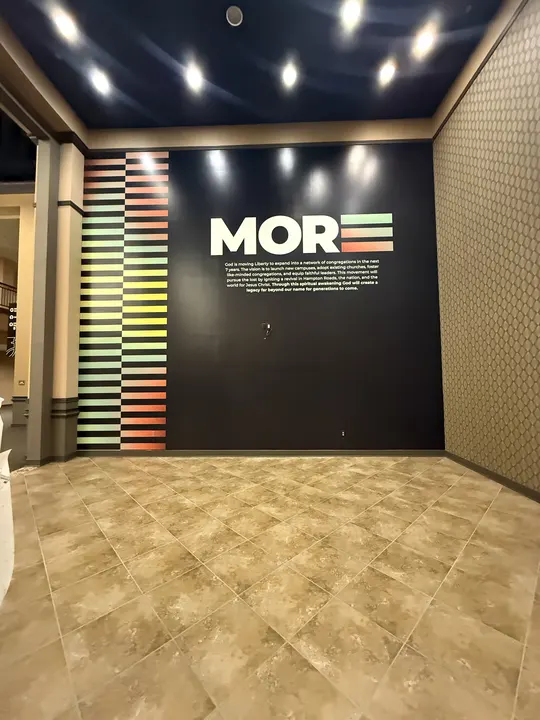 Hampton campus wall wrap installed: the MORE wall